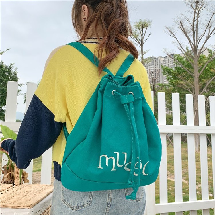 New Korean version backpack, simple letter printed canvas bag, hand-held large-capacity shopping bag, student bucket bag details Picture