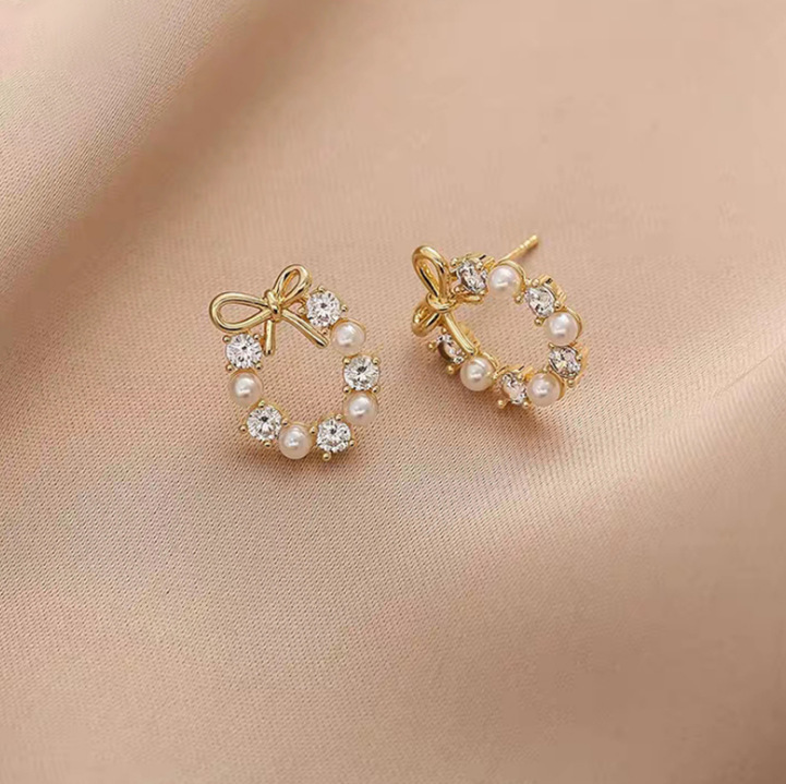 2026 New style fashionable and versatile earrings, feminine pearl stud earrings, silver needle, niche design, high-end sense earrings wholesale undefined