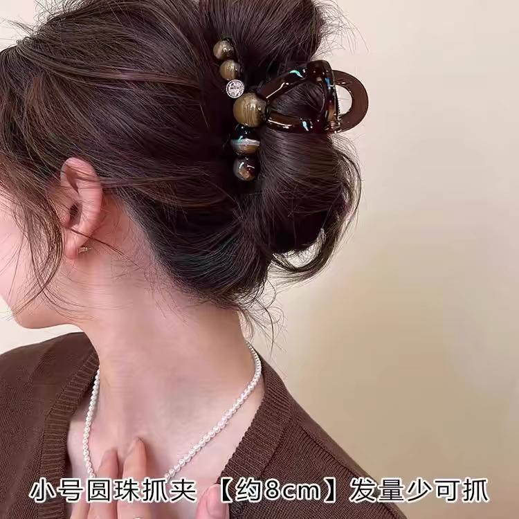 The new 2025 version of the "Elegant and luxurious, round bead, high-end" hairpin for women has a large amount of hair and a shark clip at the back of the head undefined