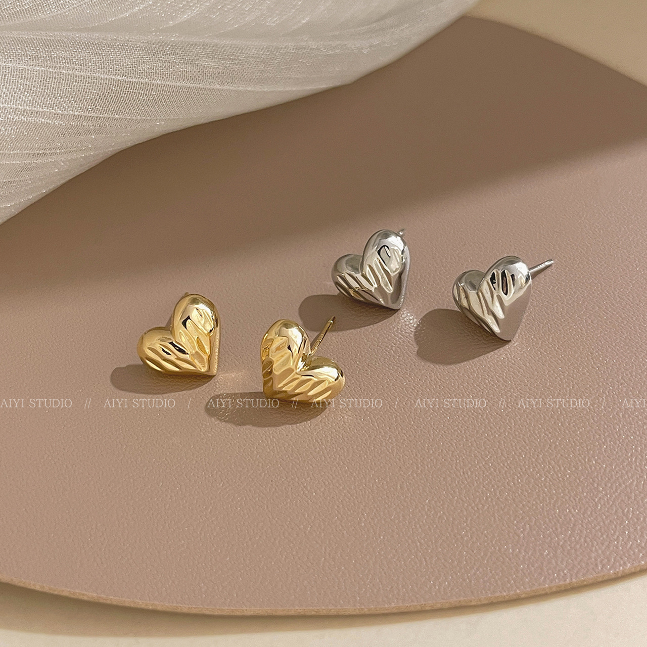 The new 2024 golden heart-shaped stud earrings for women are small, exquisite and cold style earrings with a niche design and a sense of high-end details Picture