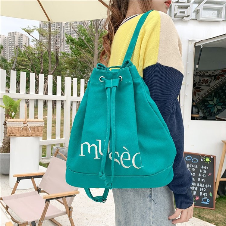 New Korean version backpack, simple letter printed canvas bag, hand-held large-capacity shopping bag, student bucket bag Item Picture