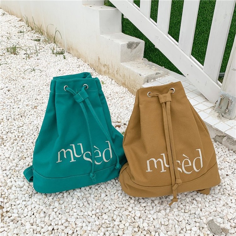 New Korean version backpack, simple letter printed canvas bag, hand-held large-capacity shopping bag, student bucket bag Specification image