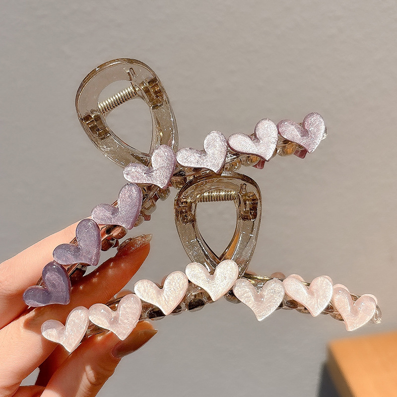 Simple jelly heart-shaped hairpin at the back of a woman's head, exuding a high-end and elegant charm. Shark clip, semi-tied hair accessory, hairpin details Picture