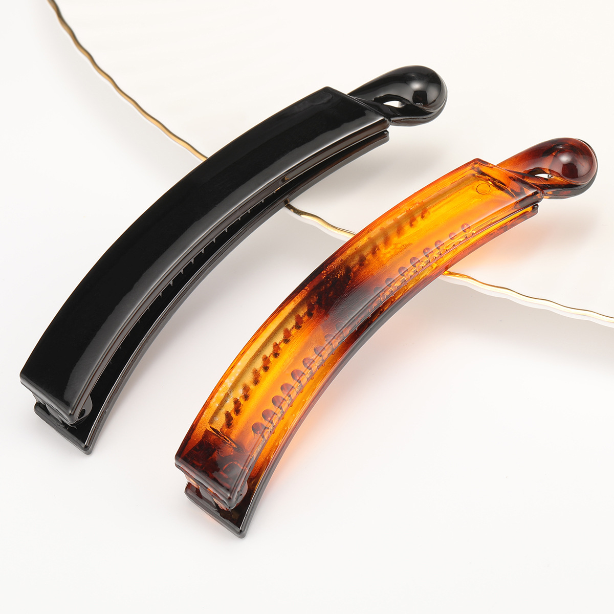 This is a fashionable and elegant hair accessory with a horizontal clip on the back of the head and a Japanese or Korean hairpin. It features a solid color banana clip and a vertical clip for women full image