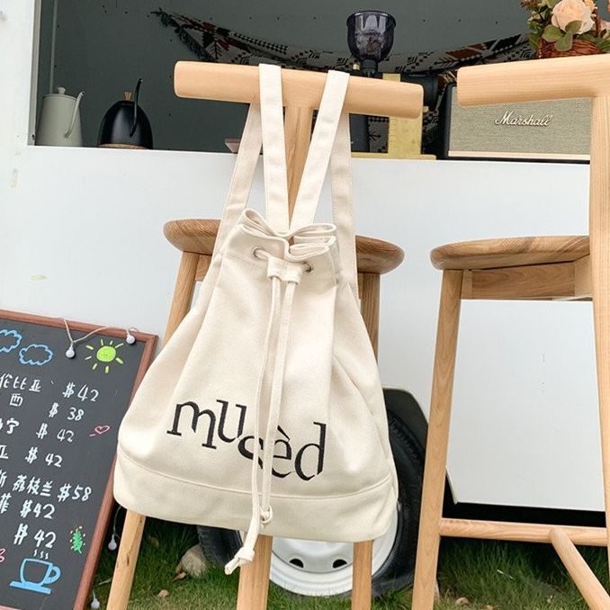New Korean version backpack, simple letter printed canvas bag, hand-held large-capacity shopping bag, student bucket bag full image