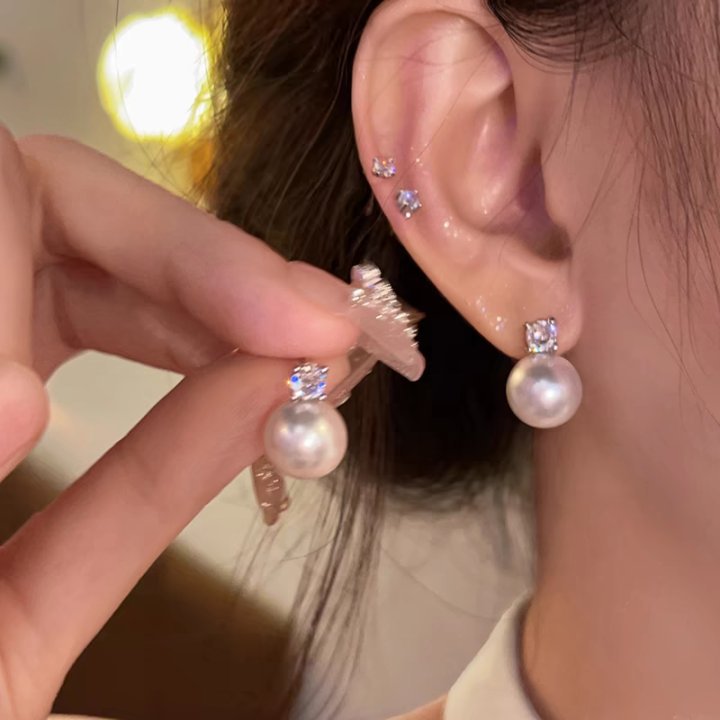 气质珍珠耳钉女2025新款轻奢高级感花朵耳环小众设计百搭耳饰批发 undefined