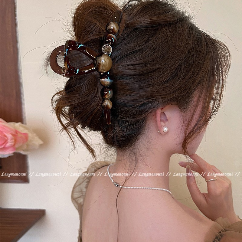 The new 2025 version of the "Elegant and luxurious, round bead, high-end" hairpin for women has a large amount of hair and a shark clip at the back of the head undefined