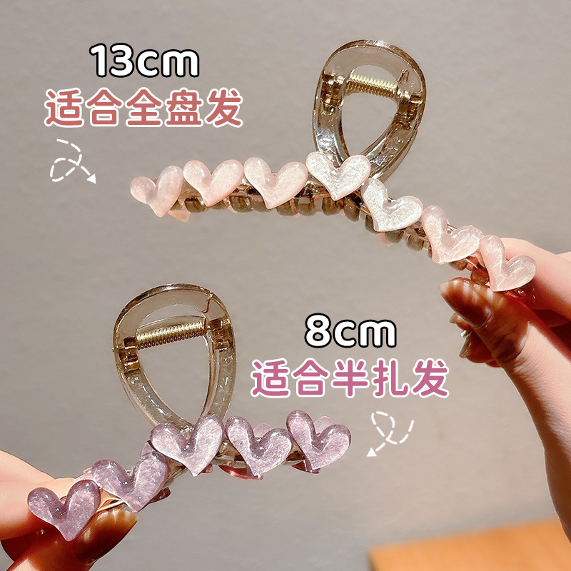Simple jelly heart-shaped hairpin at the back of a woman's head, exuding a high-end and elegant charm. Shark clip, semi-tied hair accessory, hairpin Specification image