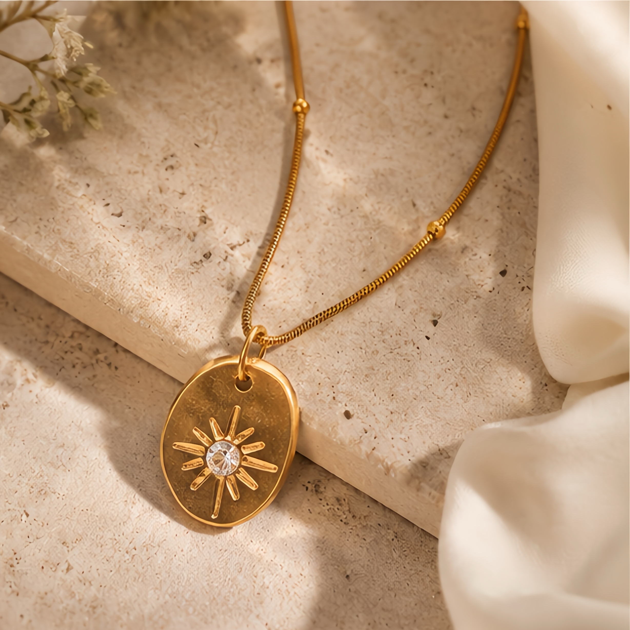 Irregular oval embossed sun pattern pendant, stainless steel snake bone chain, light luxury commuting outfit, simple Korean style, high-end collarbone neck accessory details Picture