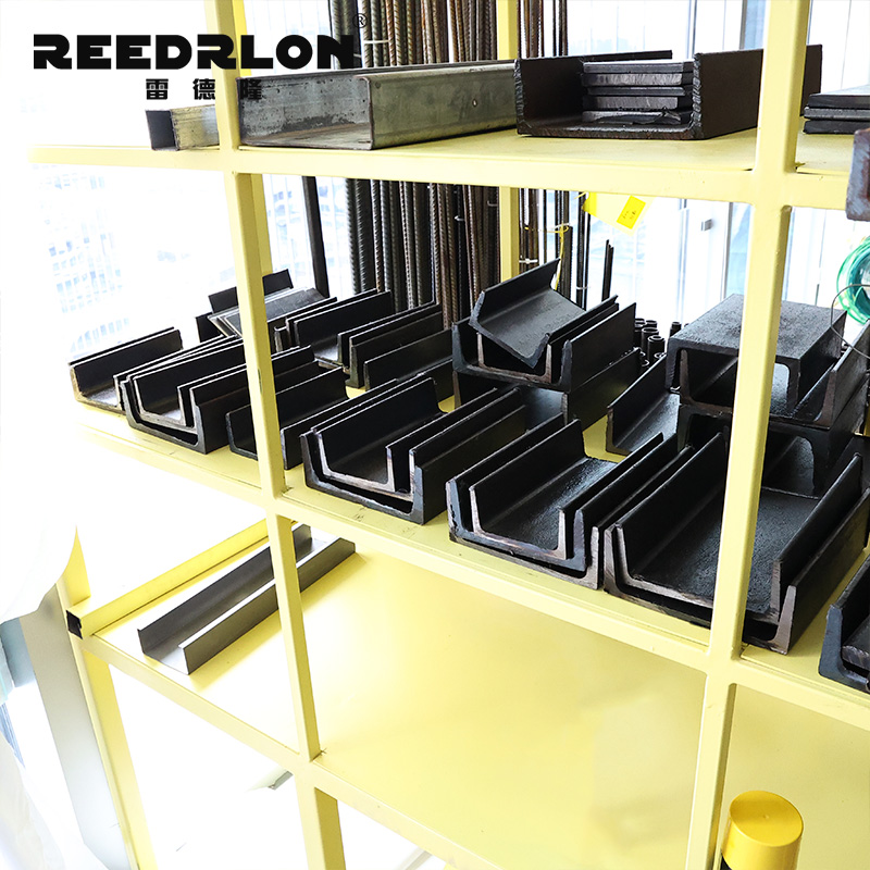 Black U-shaped channel steel products are specially designed for steel structures and used on yellow shelves for display