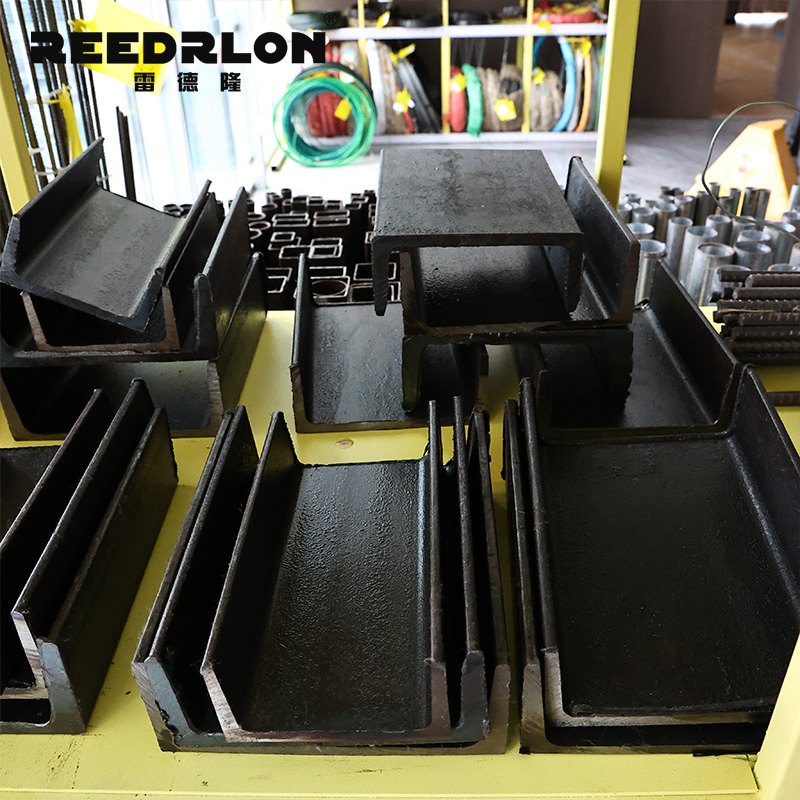 Black U-shaped channel steel products are specially designed for steel structures and used on yellow shelves for display Specification image
