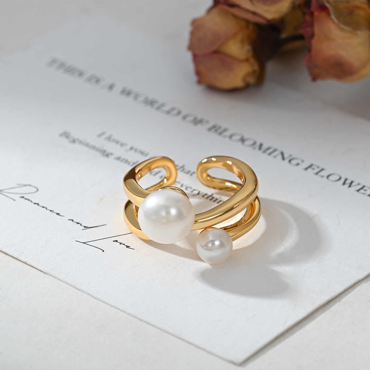 A golden double-layer large and small double pearl open ring for women, a French retro light luxury ring details Picture