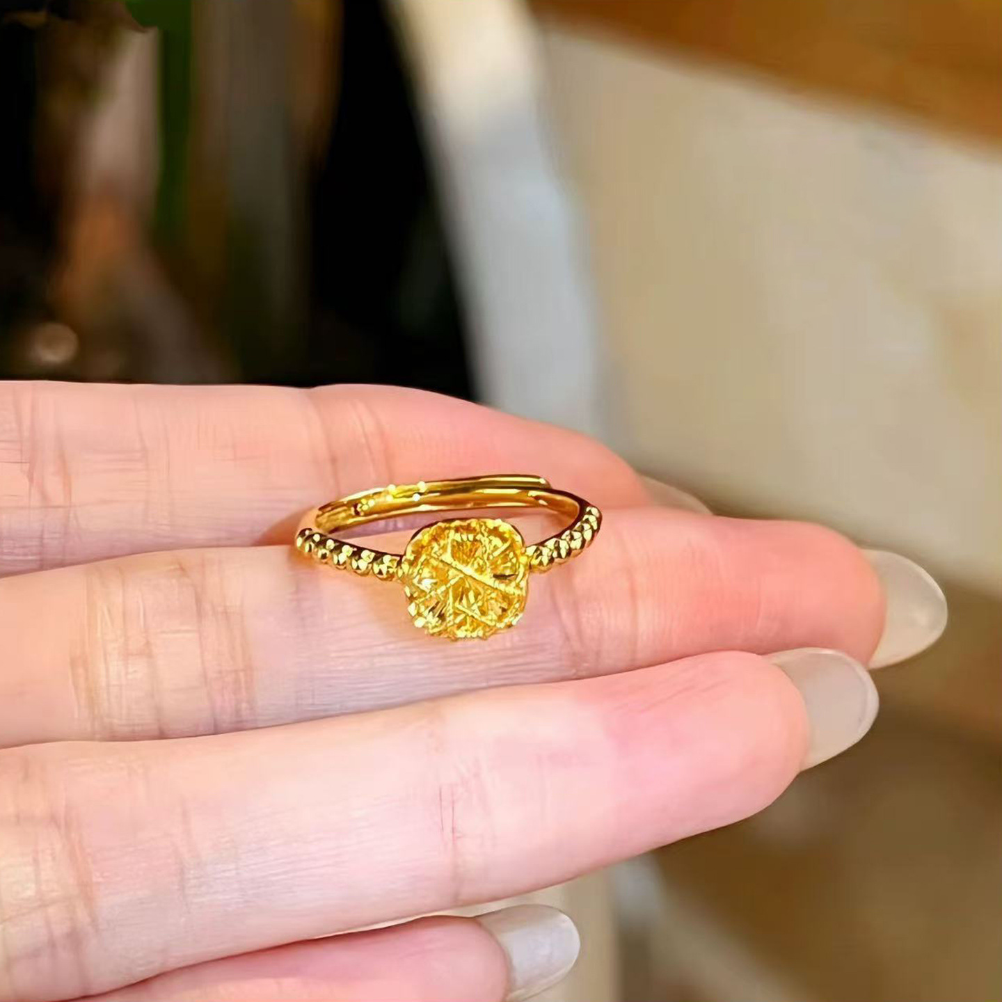 A unique, simple, luxurious and individualistic golden circular ball design ring