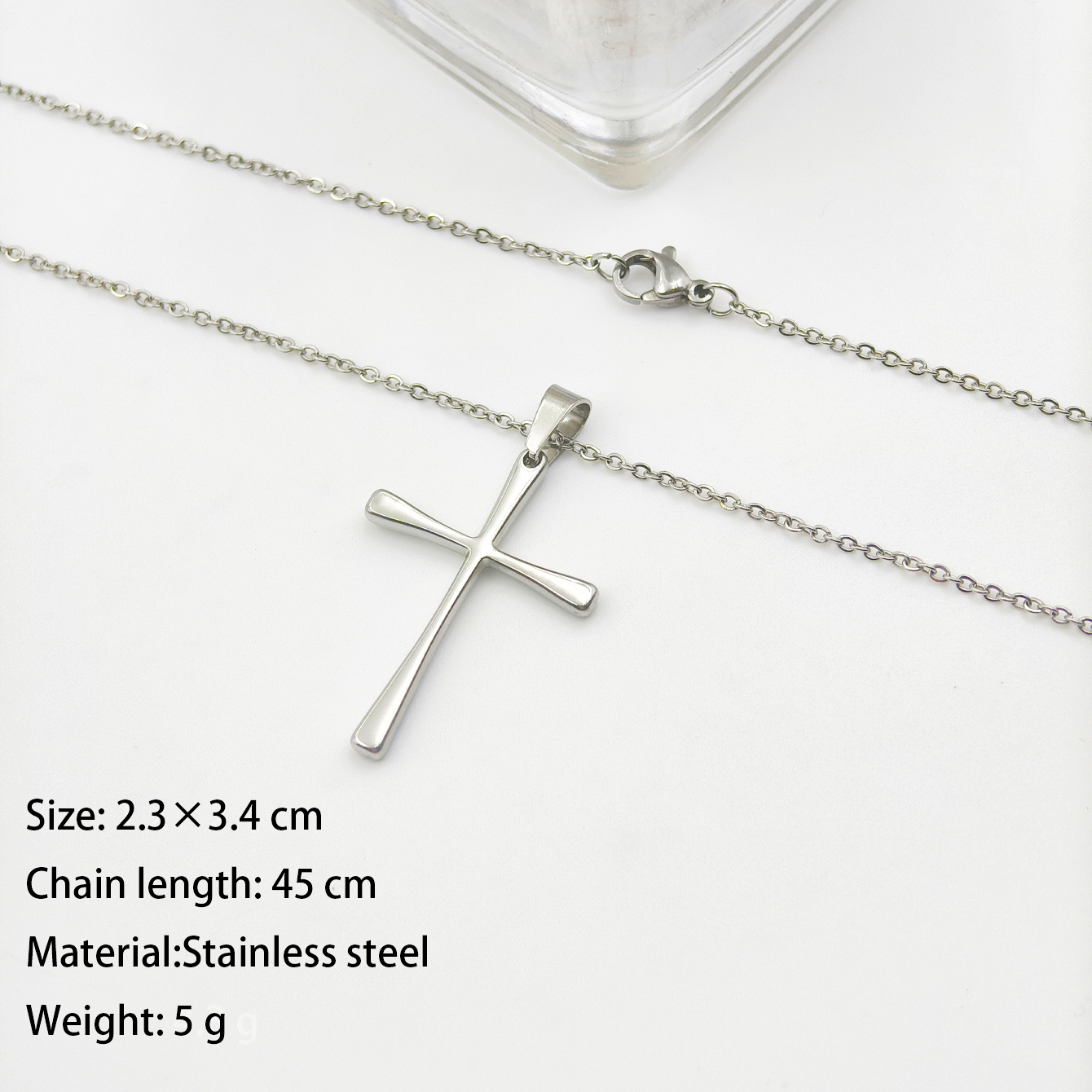 A simple polished stainless steel necklace pendant with a golden steel cross and letter accessories, a fashionable and versatile accessory for both men and women Item Picture