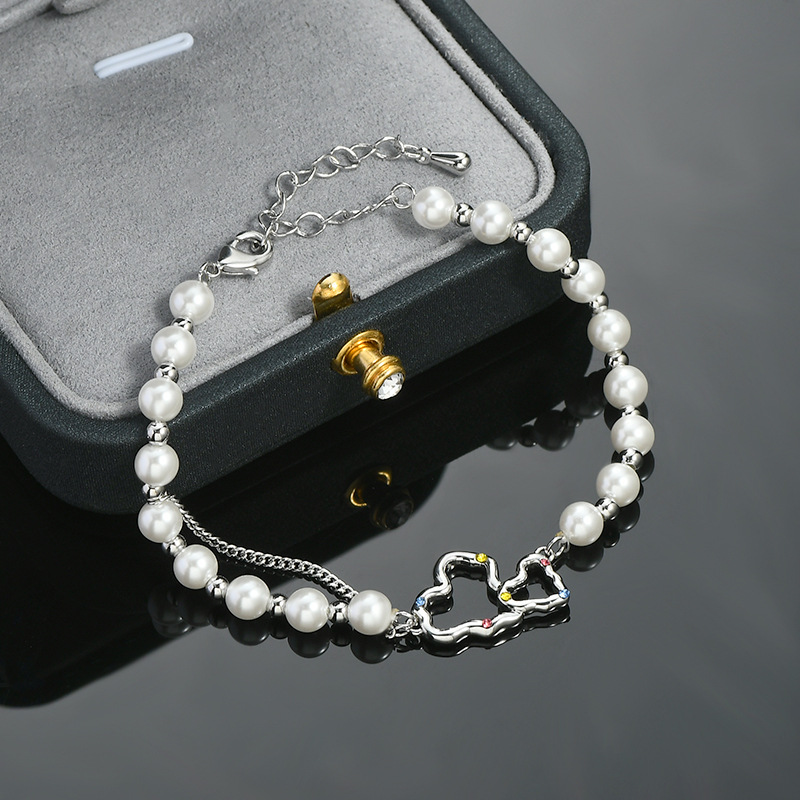 High-end, gentle and luxurious round bead bracelet with hollowed-out heart splicing, adjustable and versatile style Specification image