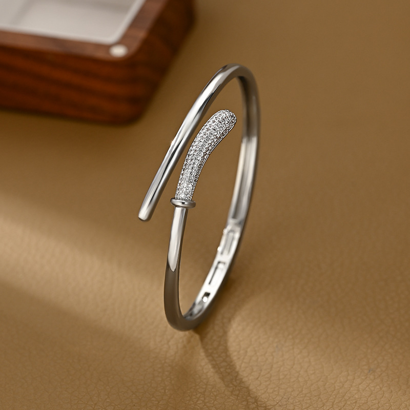 A golden staggered and interlaced open bracelet for women with partial diamond inlays, a light luxury, niche and versatile bracelet pic 6