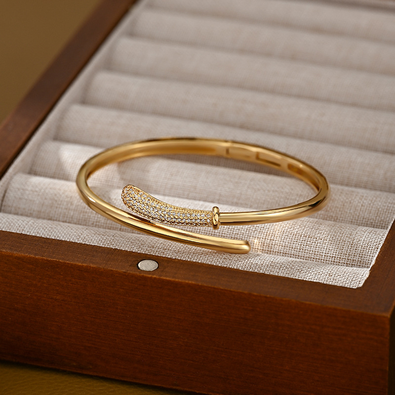 A golden staggered and interlaced open bracelet for women with partial diamond inlays, a light luxury, niche and versatile bracelet pic 3