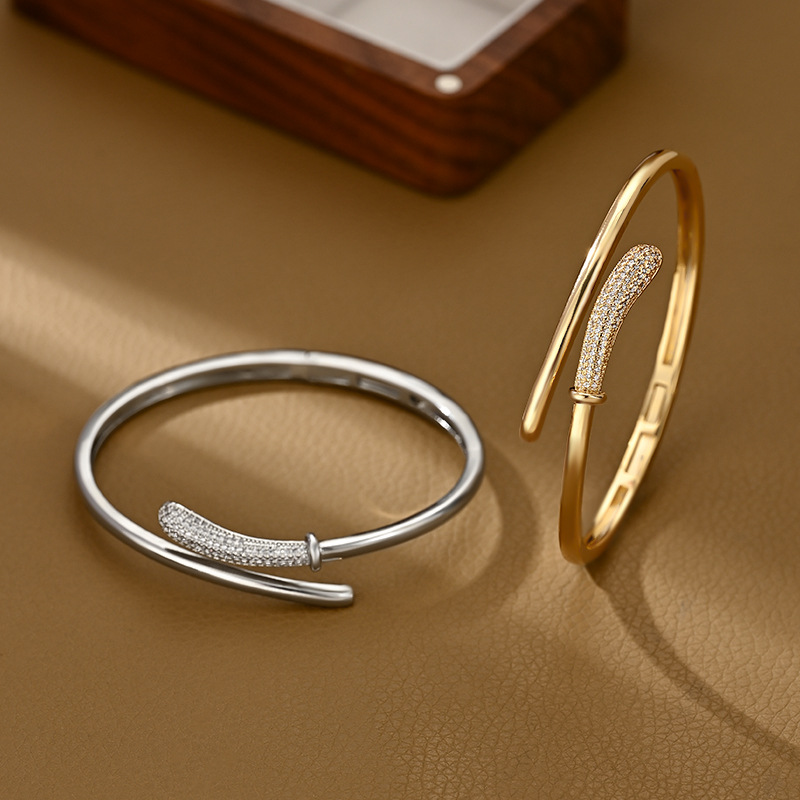 A golden staggered and interlaced open bracelet for women with partial diamond inlays, a light luxury, niche and versatile bracelet pic 1