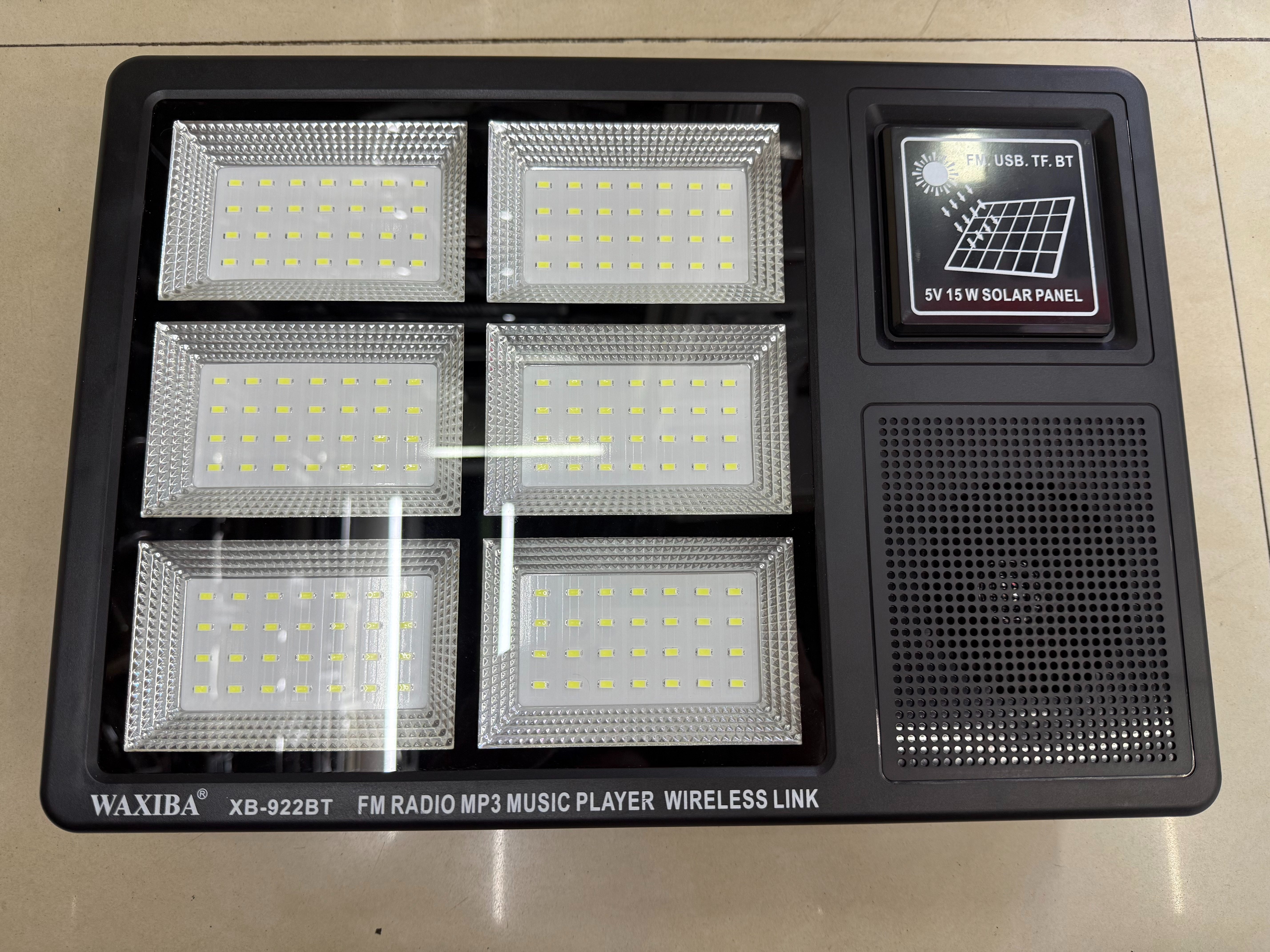 The XB-922BT solar panel radio with a light can be used for illumination in the wild, camping, outdoor equipment, emergency disaster relief, FM Bluetooth speaker, USBTF card to play music, external power supply, and multi-functional photovoltaic panel