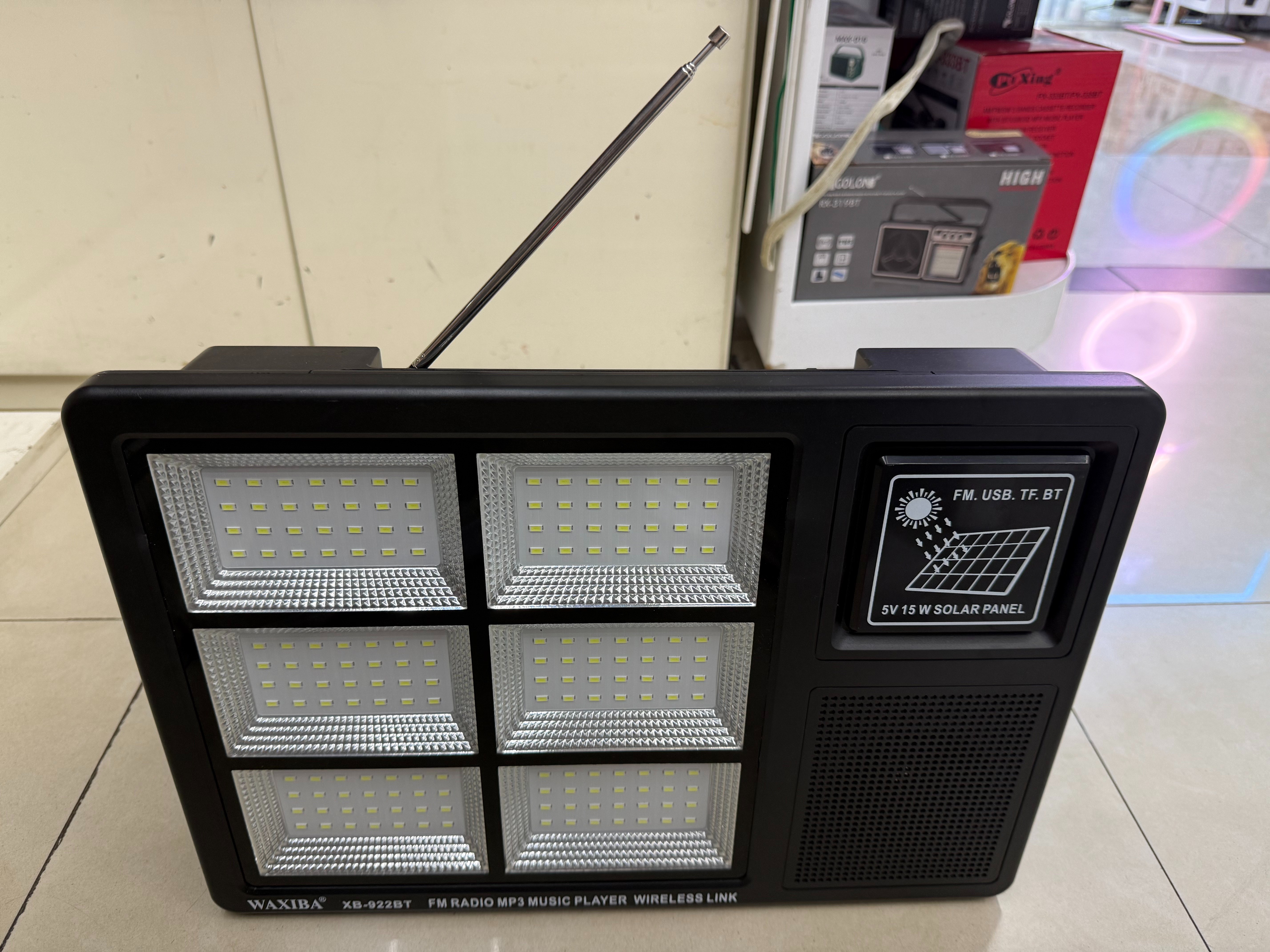 The XB-922BT solar panel radio with a light can be used for illumination in the wild, camping, outdoor equipment, emergency disaster relief, FM Bluetooth speaker, USBTF card to play music, external power supply, and multi-functional photovoltaic panel details Picture