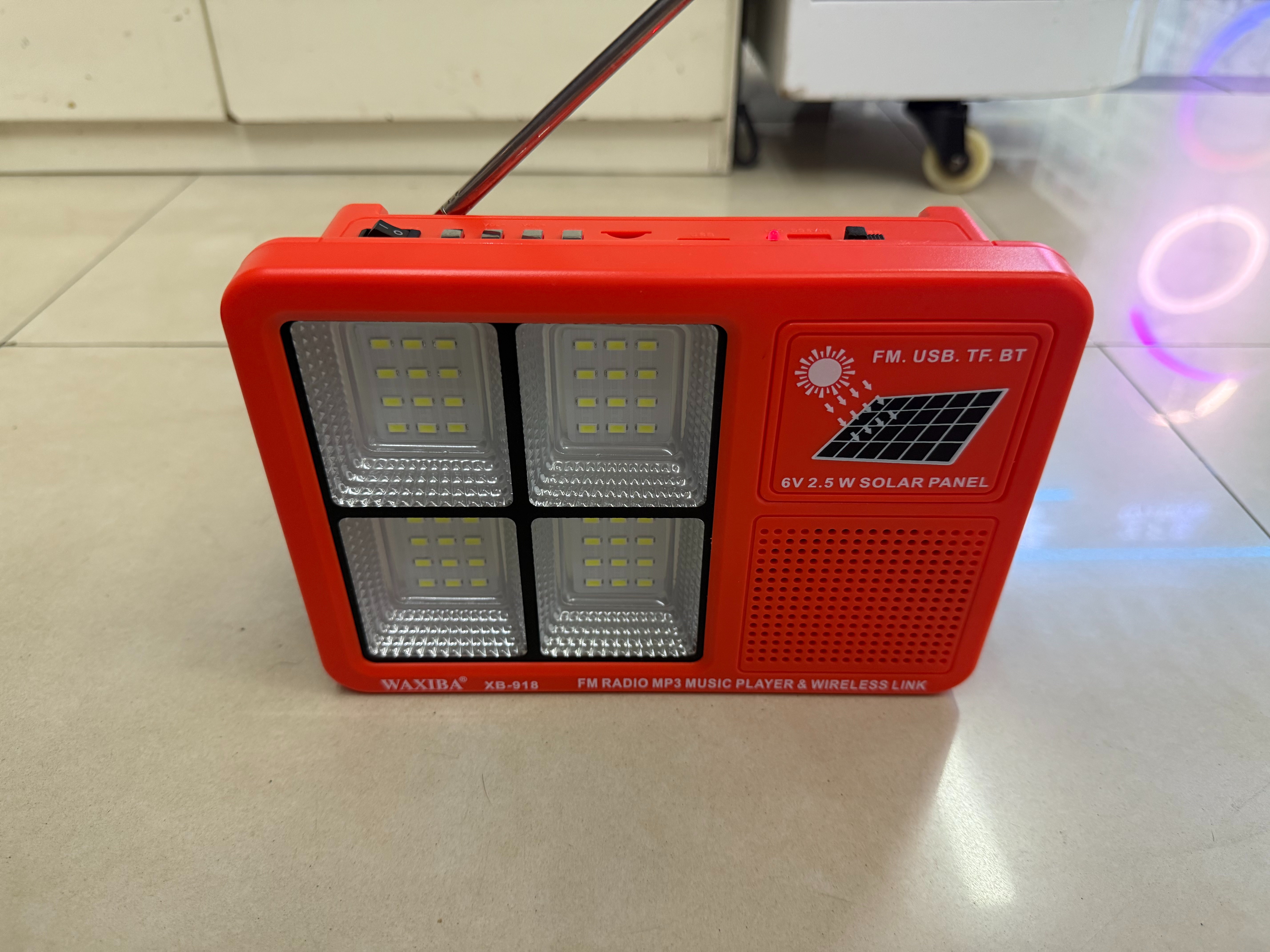 The XB-918 solar panel radio with a light can be used for illumination in the wild, camping, outdoor equipment, emergency disaster relief, FM Bluetooth speaker, USBTF card to play music, external power supply, and multi-functional photovoltaic panel details Picture