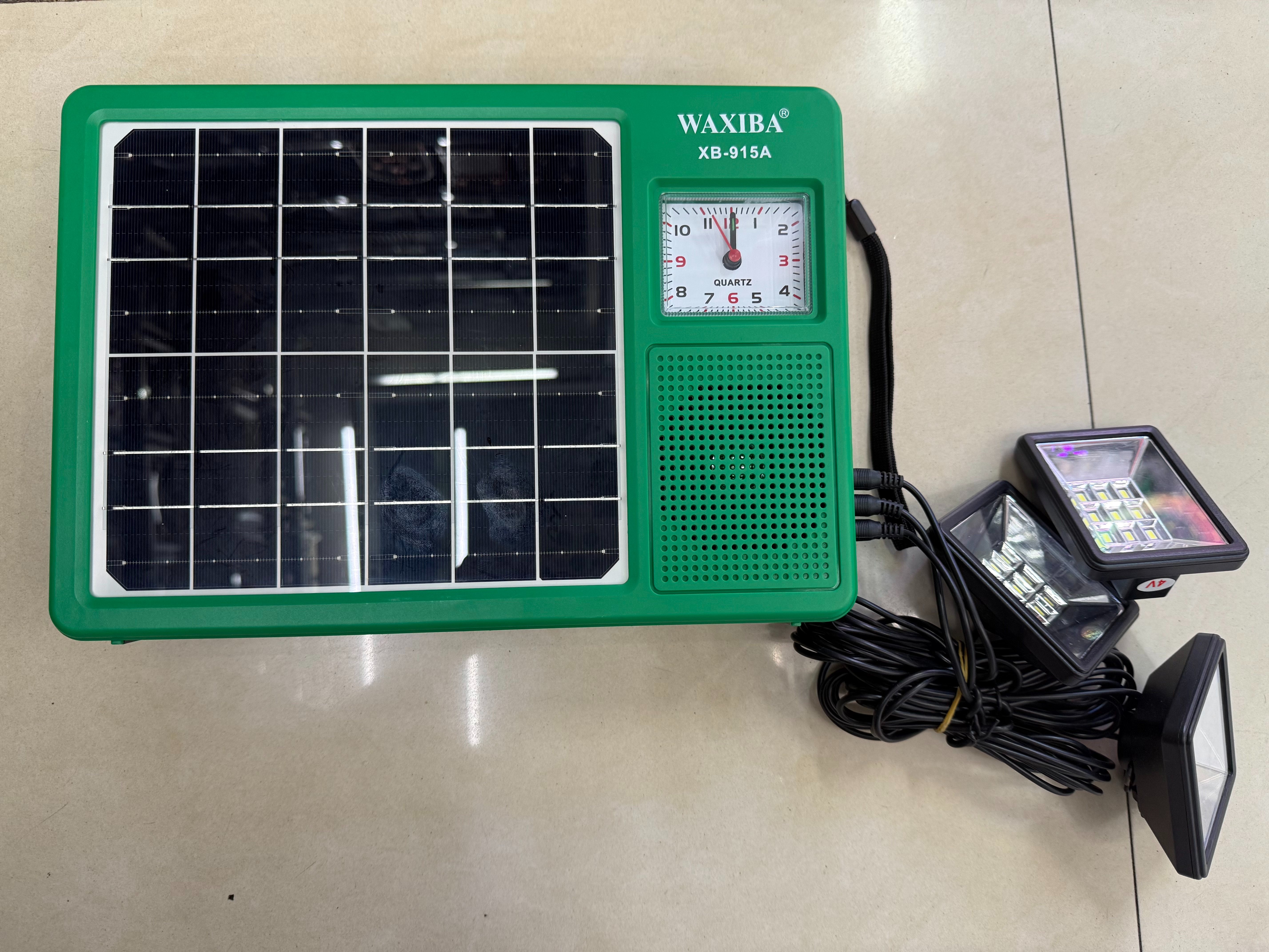 The XB-915A solar panel radio, equipped with a clock and a light, can be used for lighting in the wild, camping, outdoor equipment, emergency disaster relief, FM Bluetooth speaker, USBTF card for playing music, external power supply, and multi-functional photovoltaic panel
