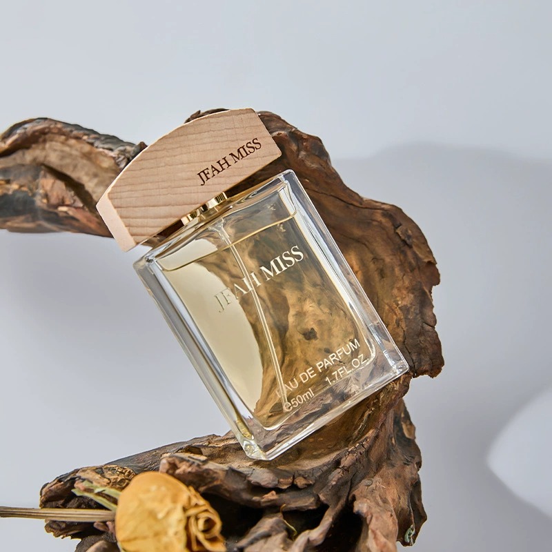 A transparent glass perfume bottle with a wooden cap, decorated on a dead wood, is a shell Jesus mural hanging art decoration Item Picture