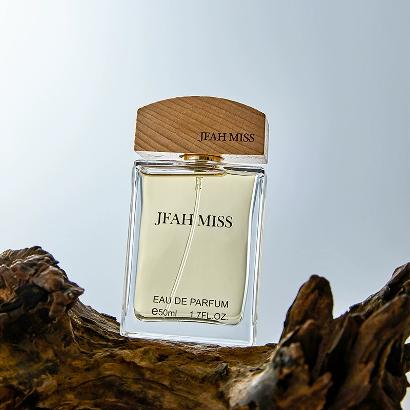 A transparent glass perfume bottle with a wooden cap, decorated on a dead wood, is a shell Jesus mural hanging art decoration details Picture