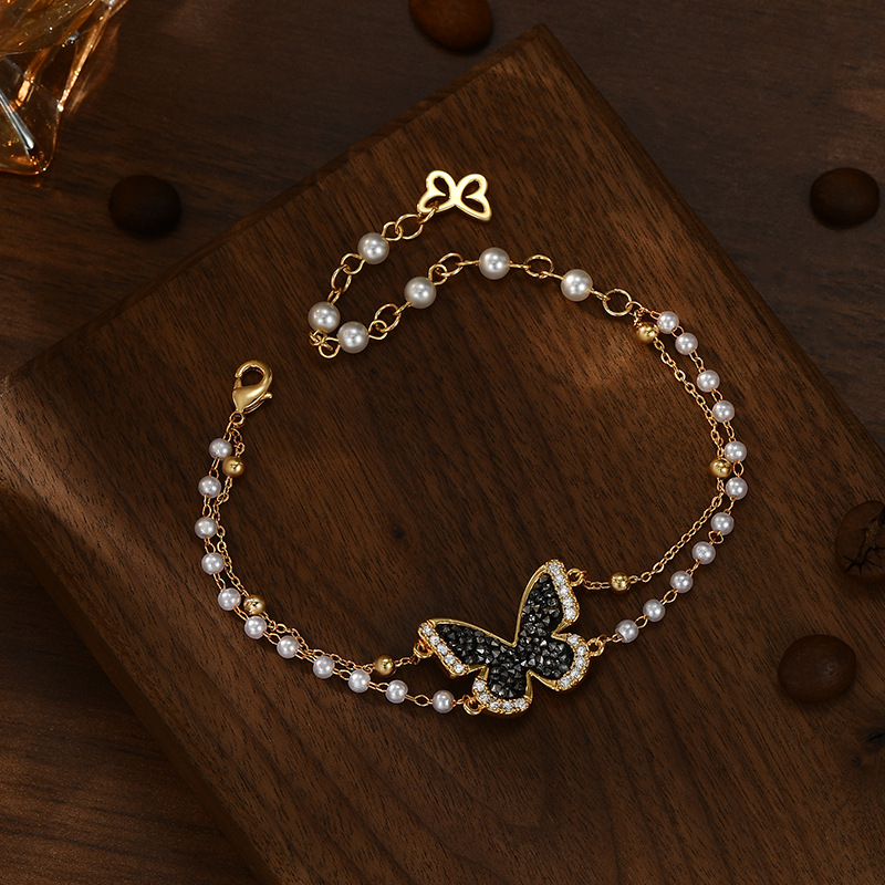 Black diamond mariposa perla apilada cadena en la mano sensación de ambiente elegante exquisita pulsera versátil