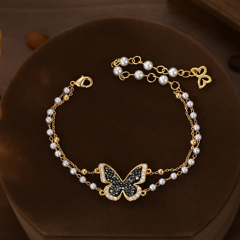 Black diamond mariposa perla apilada cadena en la mano sensación de ambiente elegante exquisita pulsera versátil Application Scenario