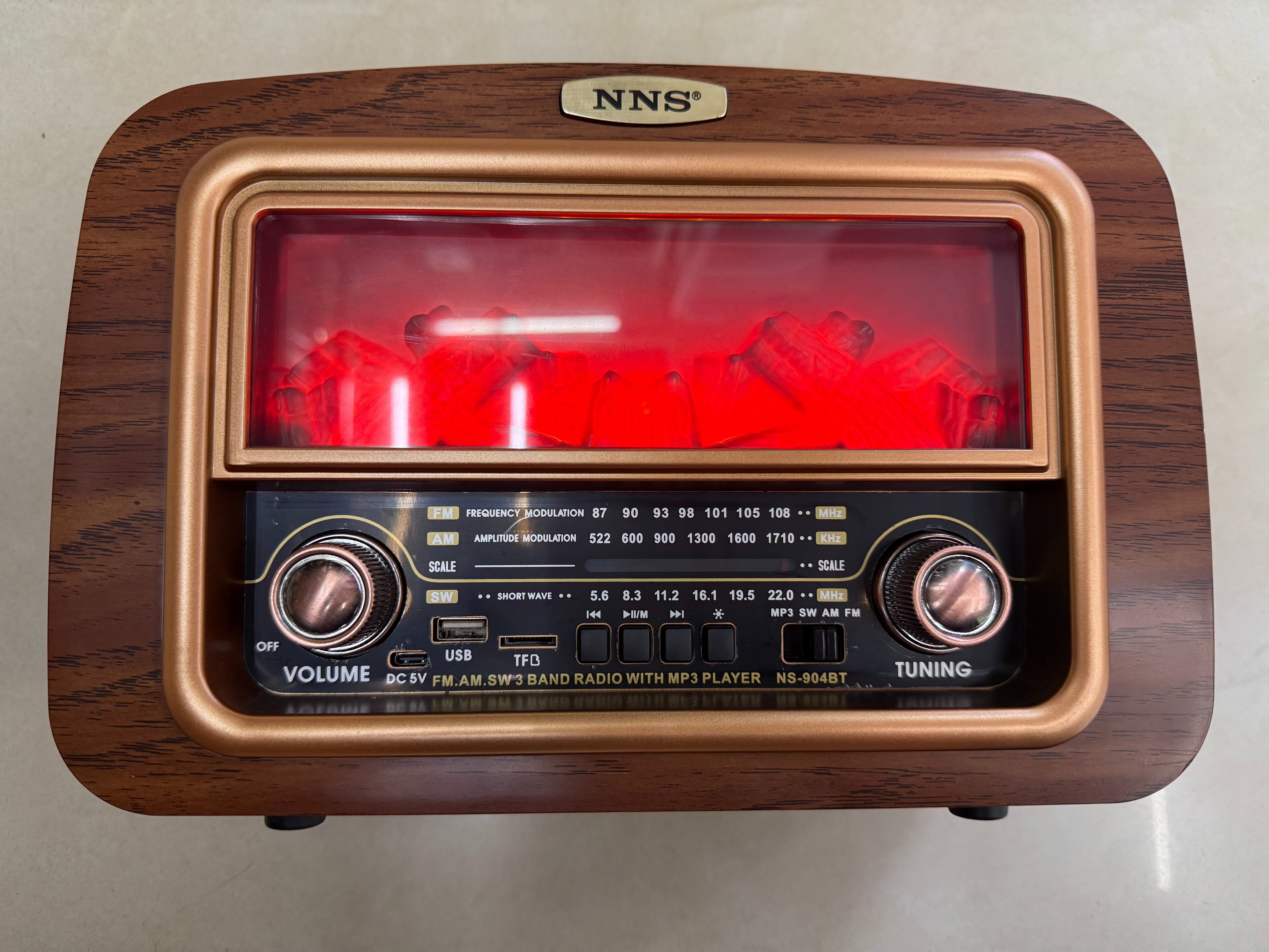 NS-904BT new retro radio Bluetooth speaker, wood grain stove shape, charcoal fire shape, light band, multi-functional desktop decoration, USB music, TF card for playing music, suitable for gifting to the elderly