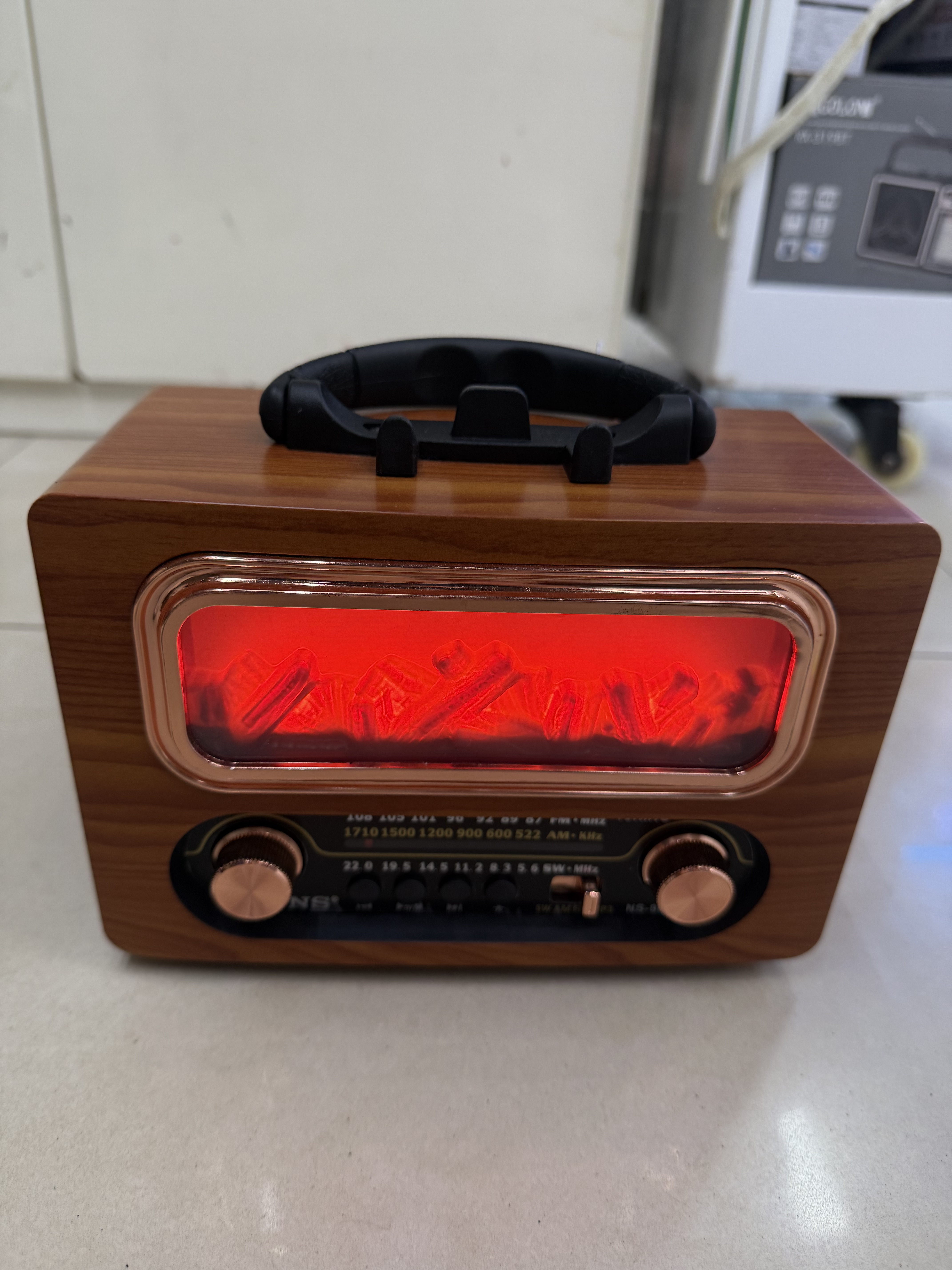 NS-902BT, a new retro radio Bluetooth speaker, features a wood-grain firewood-shaped design with a light, multi-band and multi-functional desktop decoration, USB music, and a TF card for playing music. It is suitable for giving as a gift to the elderly details Picture