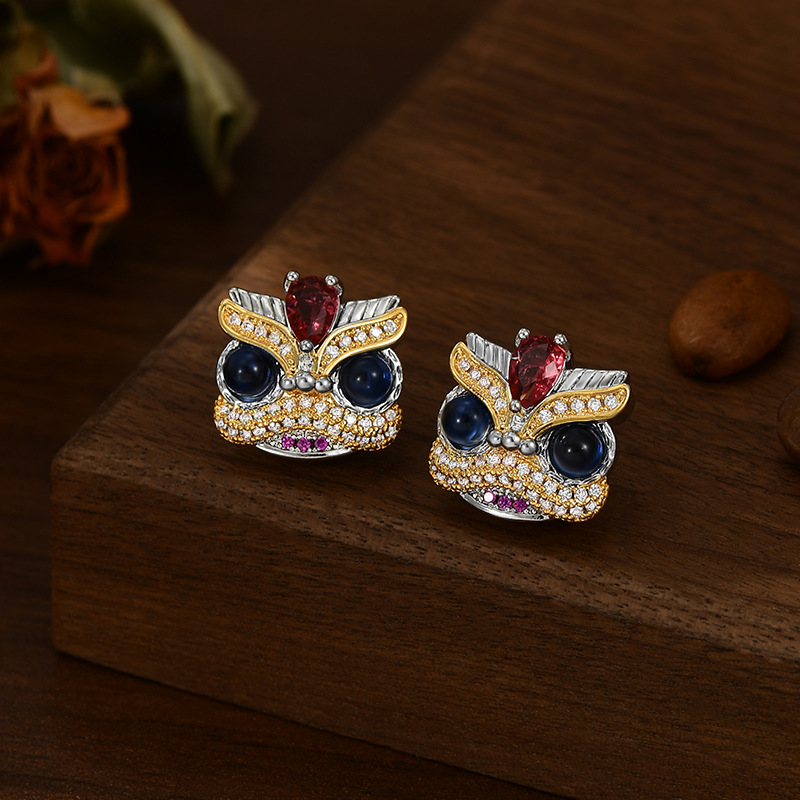 "National trend three-dimensional lion dance color gemstone contrasting color stud earrings for women, gold and silver color separation new Chinese-style niche individuality earrings.