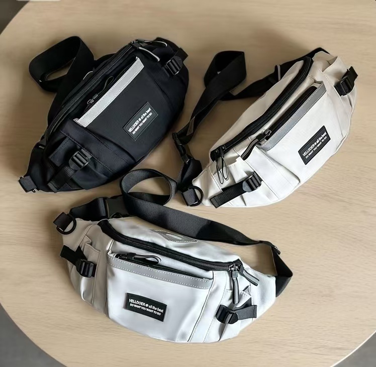 The multi-color spliced casual waist bag in beige, black and gray is a simple, fashionable and multi-functional sports bag suitable for both men and women