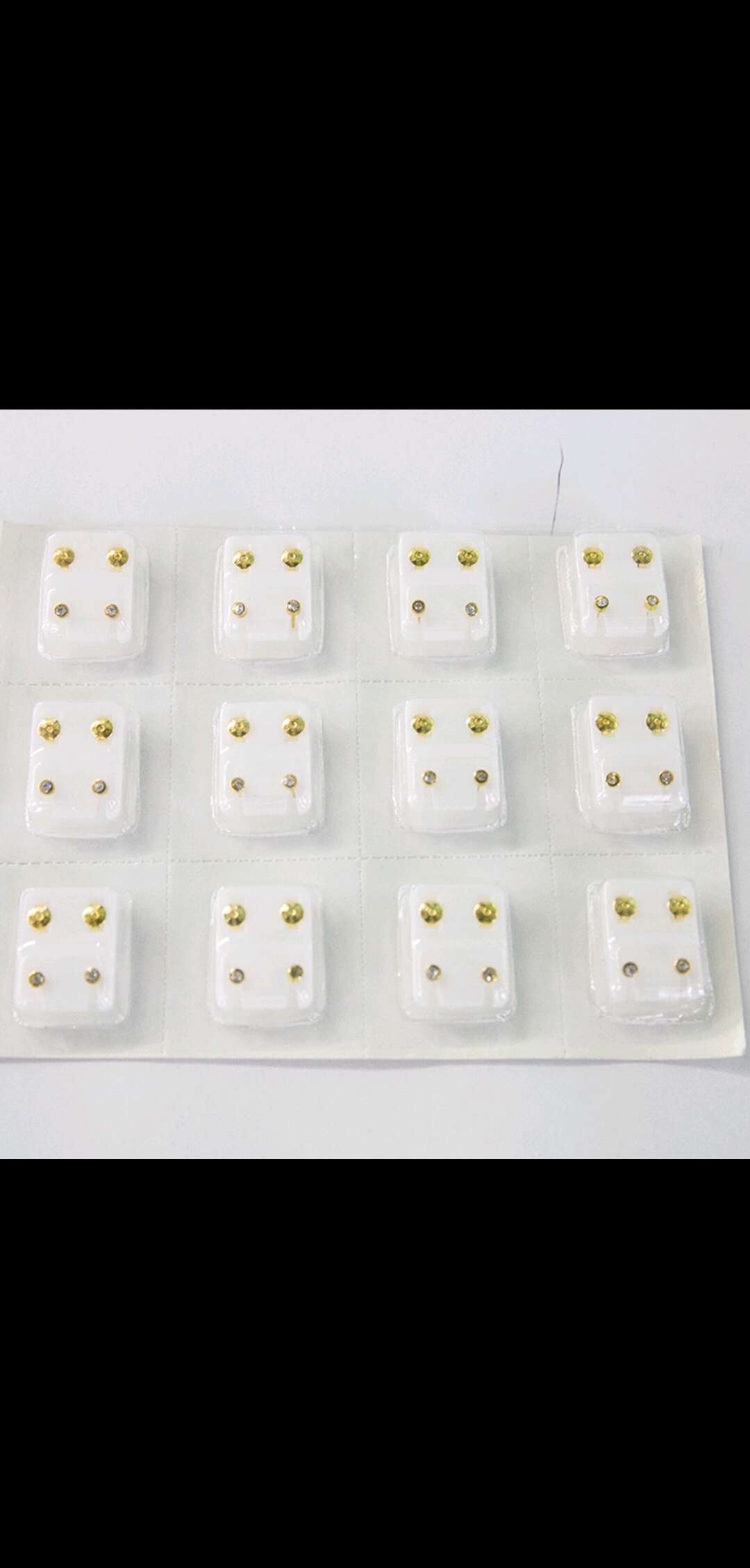 Insert ear holes and ear studs into blister cards
