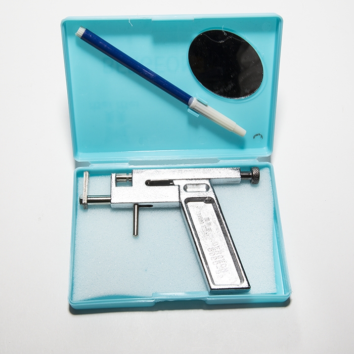 An iron gun for piercing ears details Picture