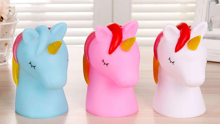 A small night lamp with colorful enamel on the head of a unicorn thumbnail