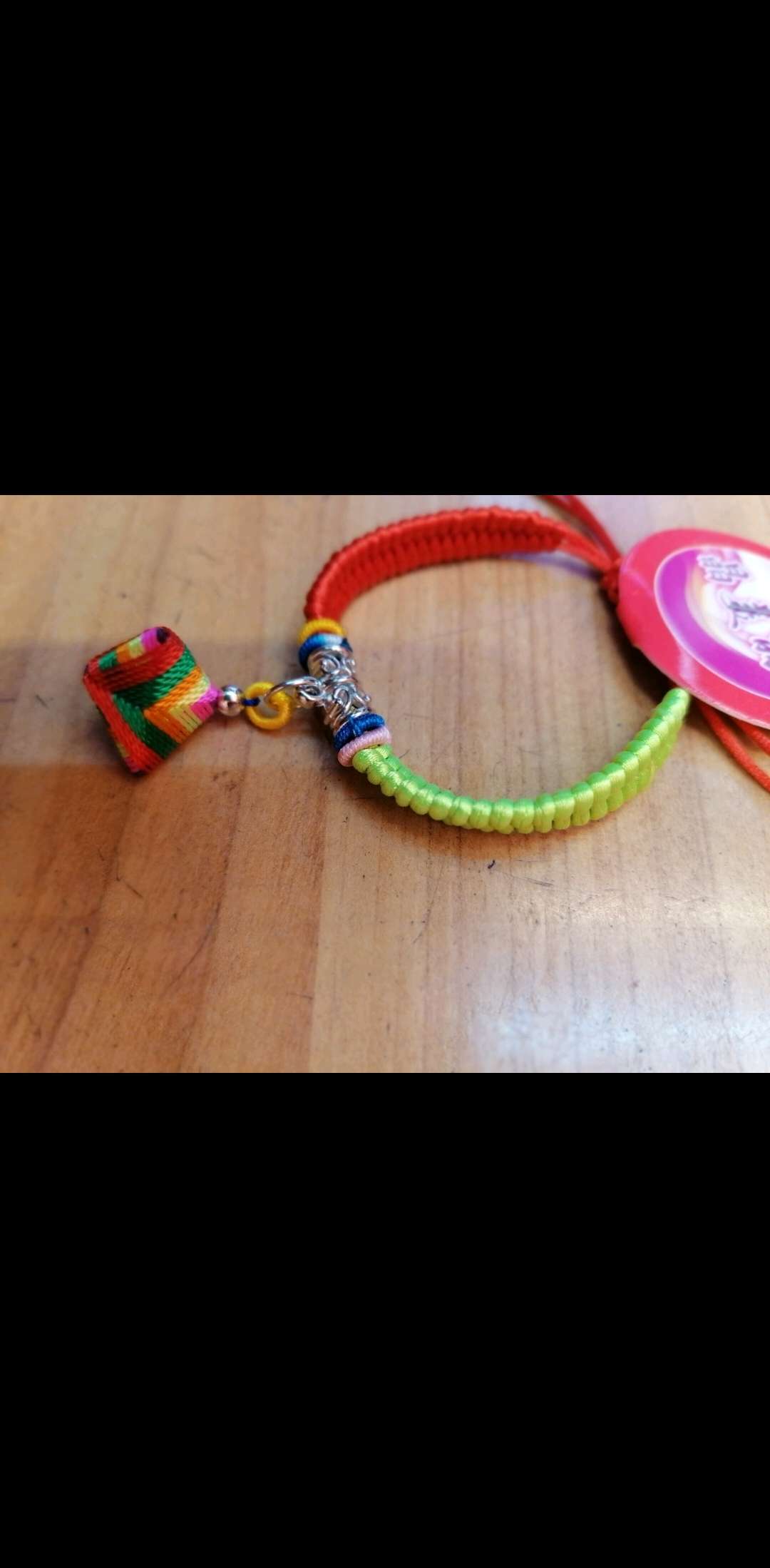 A two-color string bracelet for the Dragon Boat Festival is hung with a lucky ball of zongzi Specification image