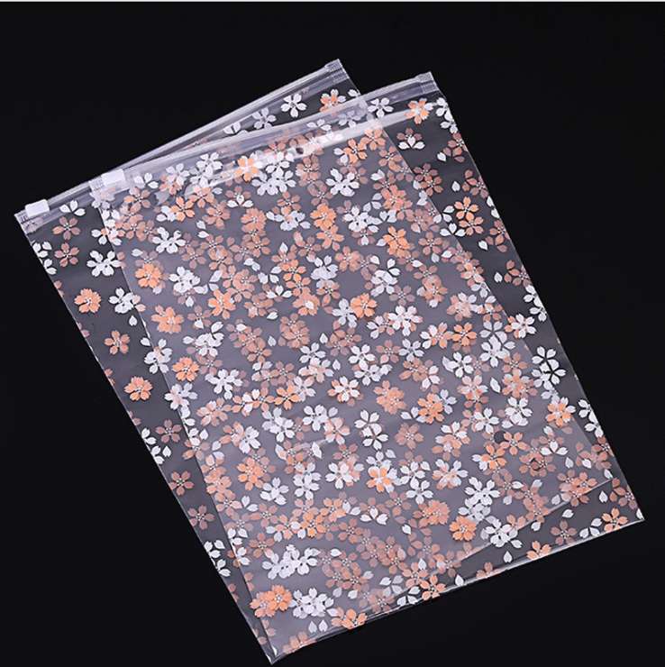 Cherry blossom style universal pe zipper bag storage bag, clothing zipper packaging bag in stock, printed sealed storage bag wholesale undefined