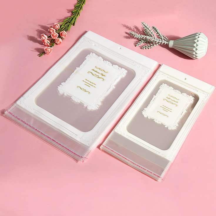 Factory stock of universal opp bags, self-adhesive white pearlescent film card head bags, transparent card head bags, colored card head round hole aircraft jewelry packaging bags, transparent plastic bags, hanging card bags, 1000 pieces per bundle undefined
