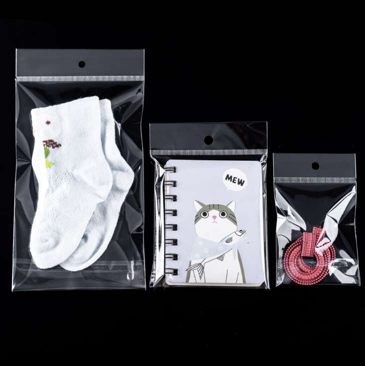 Factory stock of universal opp bags, self-adhesive white pearlescent film card head bags, transparent card head bags, colored card head round hole aircraft jewelry packaging bags, transparent plastic bags, hanging card bags, 1000 pieces per bundle undefined