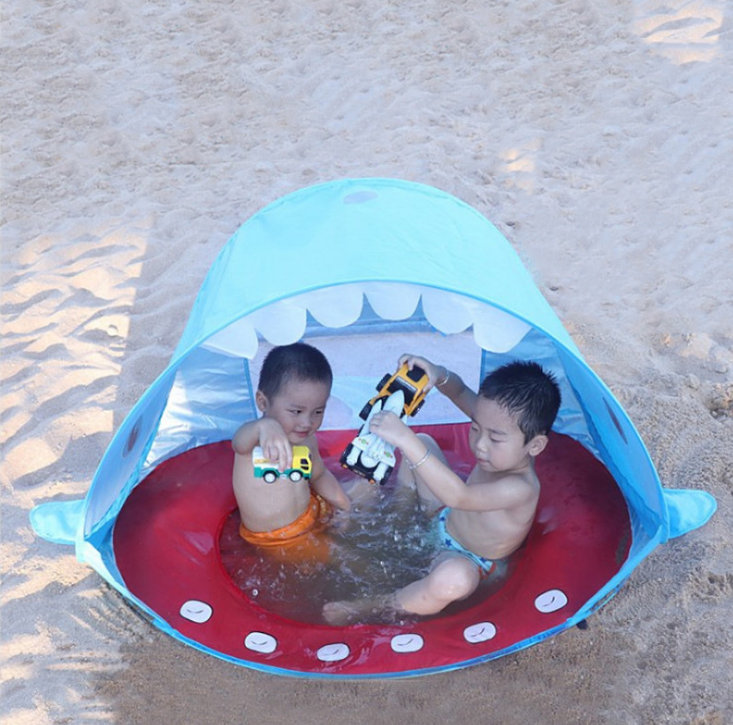 The children's beach tent is a new blue whale small tent that can be thrown away without installation. It has a play room and can be used for water play detail image 3