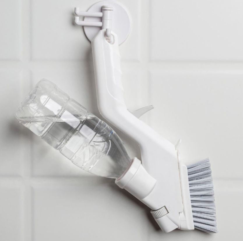Multipurpose kitchen squeegee with water spray