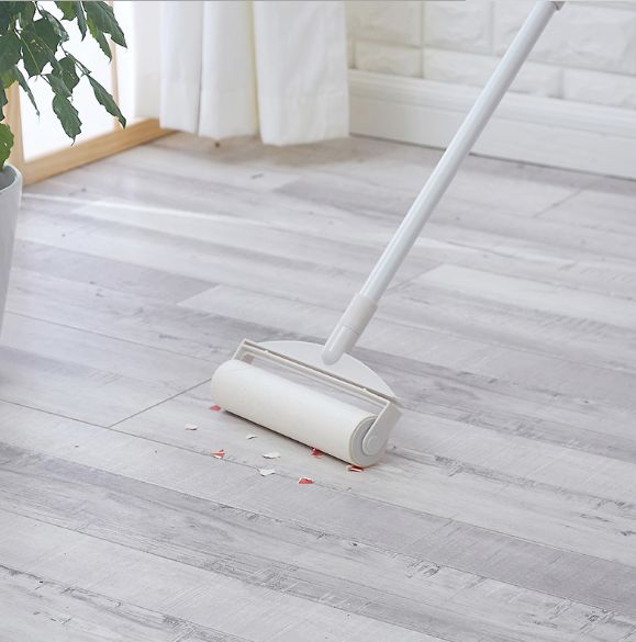 Extended telescopic floor bristle remover Item Picture
