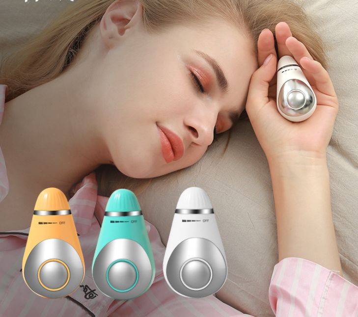 Hold USB micro-electric sleep aid device in hand