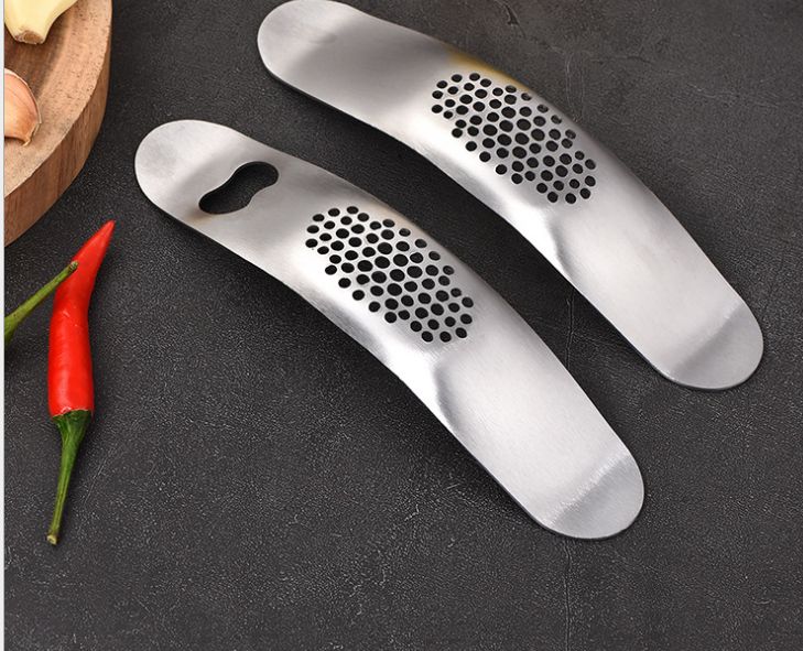 Stainless steel boat type garlic press