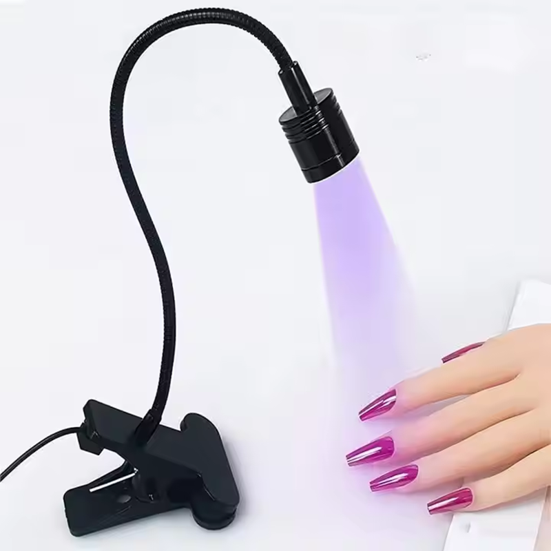 New type of nail art lamp with a cylindrical head, flexible hose, extendable usb power supply, and a dedicated wearable nail for attaching nails full figure