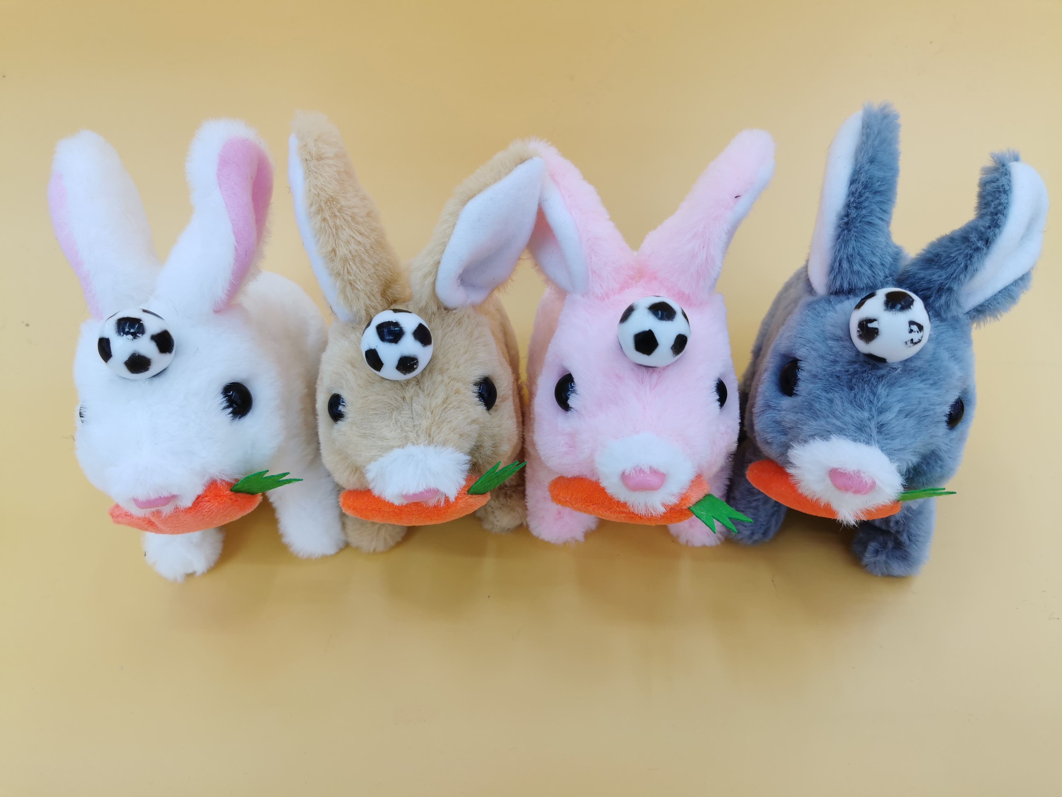 The 2025 new cute plush drawstring, tongue-stretching electric football, radish, short fur rabbit children's simulation toy can walk, move and bark
