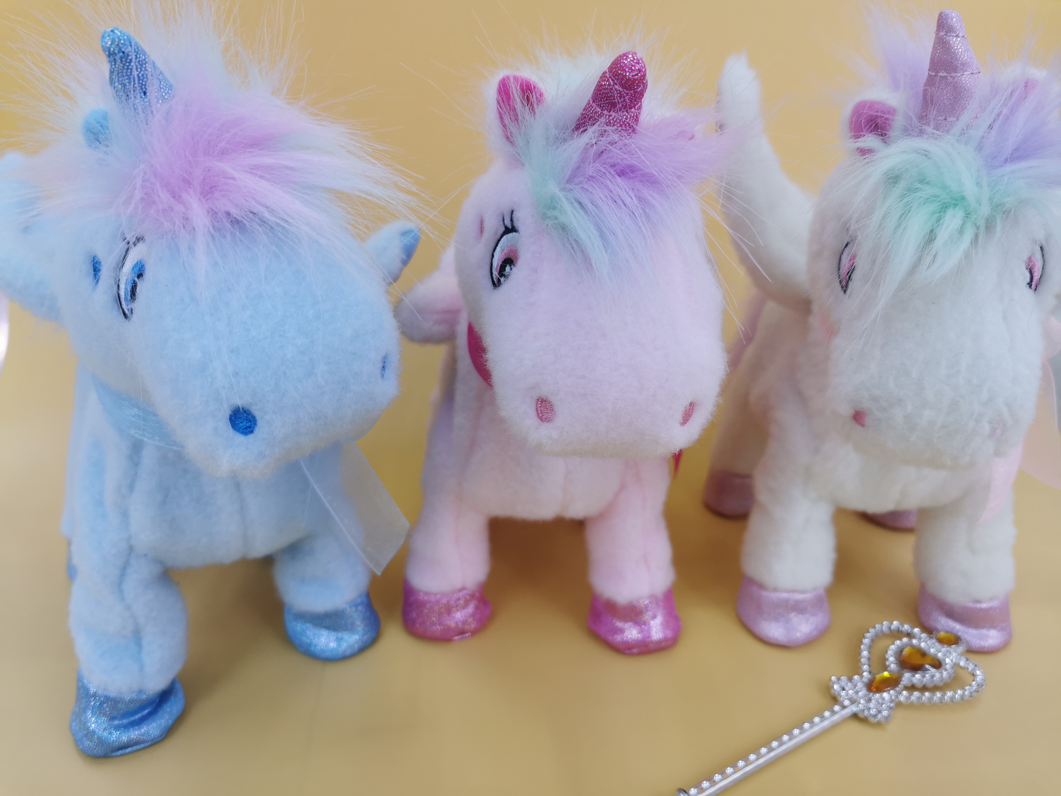 The 2025 new cute plush drawstring tongue-sticking electric fairy wand unicorn