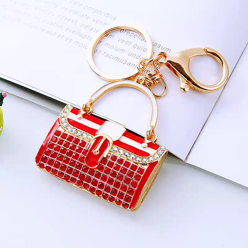 Diamond-encrusted striped small shoulder bag shaped car keychain, cute metal bag pendant keychain, creative and fashionable motorcycle keychain detail image 4